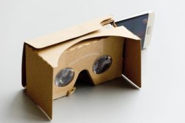 A Samsung Galaxy S7 Edge is positioned halfway into a Google Cardboard unit, Tuesday, March 15, 2016, in New York. Google Cardboard is essentially a piece of cardboard folded into a box that's slightly shorter than a brick. By slipping in an iPhone or Android phone and running Google's Cardboard app, users can replicate a VR headset. (AP Photo/Mark Lennihan)