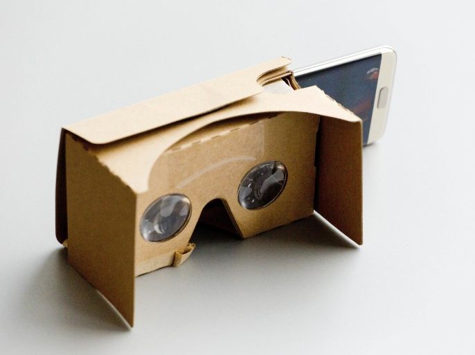 A Samsung Galaxy S7 Edge is positioned halfway into a Google Cardboard unit, Tuesday, March 15, 2016, in New York. Google Cardboard is essentially a piece of cardboard folded into a box that's slightly shorter than a brick. By slipping in an iPhone or Android phone and running Google's Cardboard app, users can replicate a VR headset. (AP Photo/Mark Lennihan)