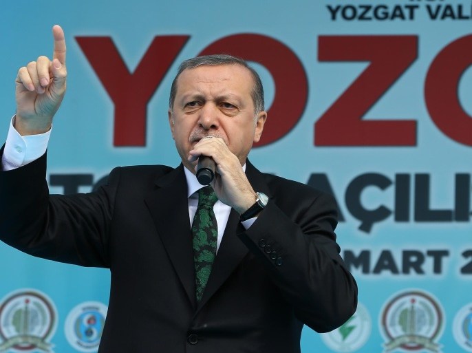 Turkish President Recep Tayyip Erdogan addresses a meeting in Sorgun, Yozgat, Turkey, Friday, March 25, 2016. Erdogan has criticized the Belgian authorities as "incapable" for not taking any action against one of the Brussels attackers after he was detained at the border with Syria and deported from Turkey. (AP Photo)