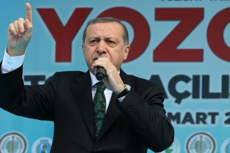 Turkish President Recep Tayyip Erdogan addresses a meeting in Sorgun, Yozgat, Turkey, Friday, March 25, 2016. Erdogan has criticized the Belgian authorities as "incapable" for not taking any action against one of the Brussels attackers after he was detained at the border with Syria and deported from Turkey. (AP Photo)