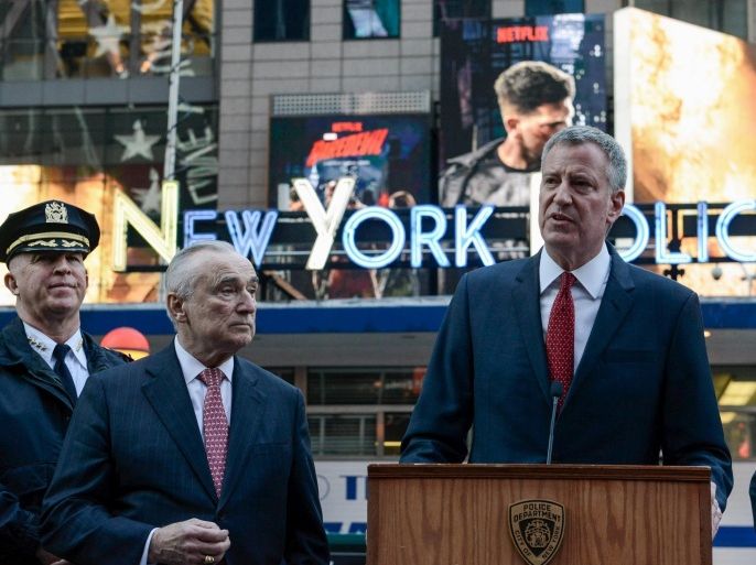 William Bratton, Police Commissioner, and Mayor of New York City, Bill de Blasio (R), speak at a news conference in Times Square in the Manhattan borough in New York, March 22, 2016. REUTERS/Stephanie Keith