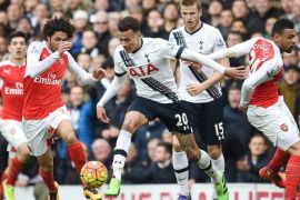Tottenham's Deli Alli (C) vies for the ball with Arsenal's Mohamed Elneny (L) during an English Premier League soccer match at White Heart Lane in London, Britain, 05 March 2016. EPA/ANDY RAIN EDITORIAL USE ONLY. No use with unauthorized audio, video, data, fixture lists, club/league logos or 'live' services. Online in-match use limited to 75 images, no video emulation. No use in betting, games or single club/league/player publications.