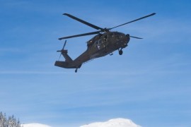 A black hawk helicopter of the convoy with US vice president Joe Biden, front, and a Super Puma helicopter of the Swiss army arrive at the Stilli airpor, in Davos, Switzerland, 18 January 2016. Joe Biden will attend the World Economic Forum WEF. The WEF takes places from January 20 to 23.