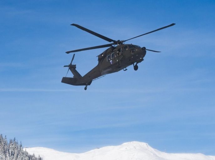 A black hawk helicopter of the convoy with US vice president Joe Biden, front, and a Super Puma helicopter of the Swiss army arrive at the Stilli airpor, in Davos, Switzerland, 18 January 2016. Joe Biden will attend the World Economic Forum WEF. The WEF takes places from January 20 to 23.