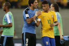 Uruguay's Luis Suarez, left, talks to Brazil's Neymar after a 2018 World Cup qualifying soccer match at the Pernambuco Arena, in Recife, Brazil, Friday, March 25, 2016. The match ended 2-2. (AP Photo/Leo Correa)