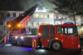 Firefighters fight a blaze at a home for asylum-seekers in Radebeul, Germany, 03 March 2016. Three people were injured in the fire. The cause of the fire is initially unclear.