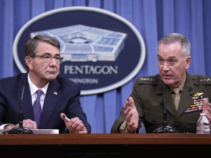 Defense Secretary Ash Carter listens at left as Joint Chiefs Chairman Gen. Joseph Dunford speaks during a news conference at the Pentagon, Friday, March 25, 2016, where they announced U.S. forces killed a senior Islamic State leader, among several key members of the militant group eliminated this week. (AP Photo/Mauel Balce Ceneta)