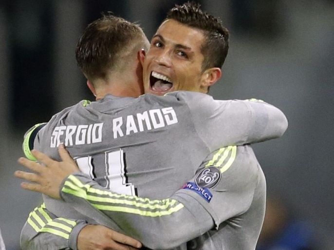 Real Madrid's Cristiano Ronaldo celebrates with teammate Sergio Ramos after scoring during a Champions League, round of 16, first-leg soccer match between Roma and Real Madrid, at the Rome Olympic stadium, Wednesday, Feb. 17, 2016. (AP Photo/Andrew Medichini)