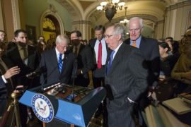 A reporter poses a question to Senate Majority Leader Mitch McConnell of Ky., second from right, during a news conference on Capitol Hill in Washington, Tuesday, Feb. 23, 2016, joined by, from right to left, Senate Majority Whip John Cornyn of Texas, Sen. John Thune, R-S.D., Sen. John Barrasso, R-Wyo., and Sen. Roger Wicker, R-Miss., following a closed-door policy meeting. The Senate will take no action on anyone President Barack Obama nominates to fill the Supreme Court vacancy, Senator McConnell said as nearly all Republicans rallied behind his calls to leave the seat vacant for the next president to fill. His announcement came after Republicans on the Senate Judiciary Committee ruled out any hearing for an Obama pick. (AP Photo/J. Scott Applewhite)