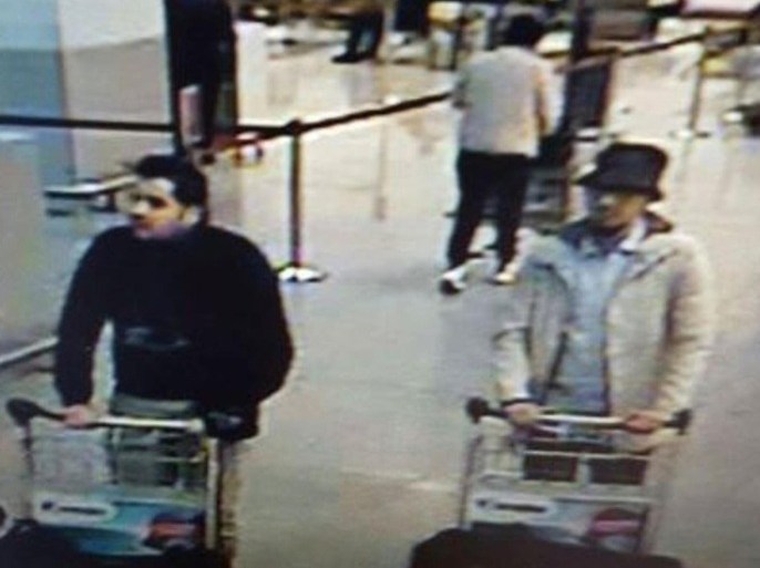 In this image provided by the Belgian Federal Police in Brussels on Tuesday, March 22, 2016 of three men who are suspected of taking part in the attacks at Belgium's Zaventem Airport. The website of Belgium's Federal Police on Monday, March 28 began carrying a 32-second video of a mysterious man in a hat suspected of having taking part in the March 22 bombing of Brussels Airport. "The police are seeking to identify this man," the site says. The implication is that the suspected accomplice of the two airport suicide bombers could still be at large. (Belgian Federal Police via AP)