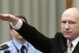 Convicted mass killer Anders Behring Breivik gestures as he enters the court room in Skien prison, Norway, 15 March 2016. Behring Breivik is charging Norwegian authorities of violating his human rights by holding him in isolation for almost five years. EPA/LISE ASERUD NORWAY OUT