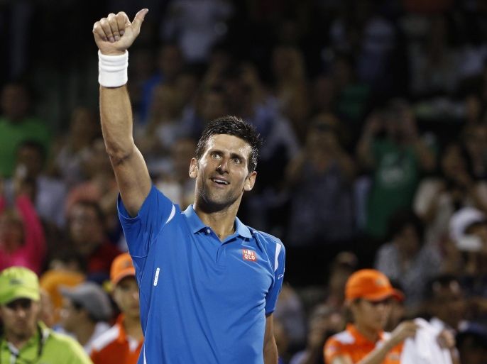 Mar 25, 2016; Key Biscayne, FL, USA; Novak Djokovic waves to fans after his match against Kyle Edmund (not pictured) during day four of the Miami Open at Crandon Park Tennis Center. Djokovic won 6-3, 6-3. Mandatory Credit: Geoff Burke-USA TODAY Sports