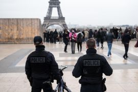 French police officers patrol at Trocadero Plaza next to the Eiffel Tower in Paris, France, Saturday, March 19, 2016. France remains under a state of emergency after the Nov. 13 attacks on a rock concert, cafes and a stadium, which claimed 130 victims. (AP Photo/Kamil Zihnioglu)