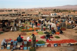 In this Wednesday, Feb. 3, 2016 photo, Amazigh villagers shop for fruits and vegetables at a weekly local market in Kalaat M'Gouna, in Ouarzazate, Morocco. Across North Africa, the Berbers number about 50 million. At least 15 million Moroccans are Amazigh, divided into different groups according to their dialects. While they speak the native Amazigh language of Tamazight, which has a large number of dialects and recently gained recognition as an official language in Morocco, many have adopted Arabic as part of a long process of Arabization and Islamization. (AP Photo/Mosa'ab Elshamy)