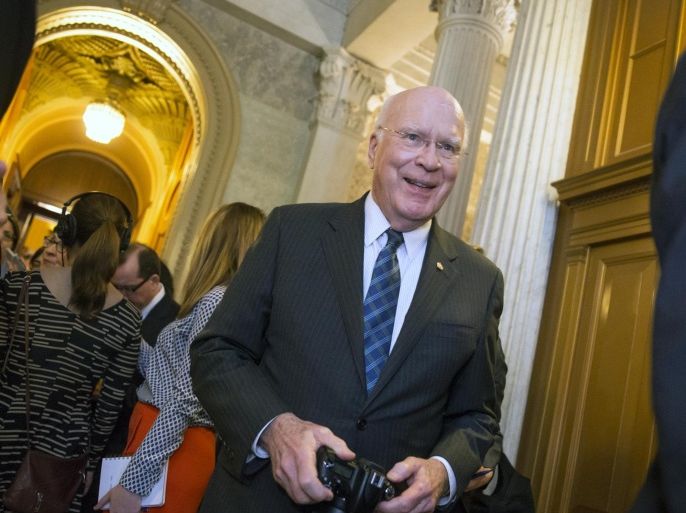 Sen. Patrick Leahy, D-Vt., the ranking member of the Senate Judiciary Committee, walks past a crowd of reporters at the Capitol after President Barack Obama announced Merrick Garland as his nominee to replace the late Justice Antonin Scalia on the Supreme Court, in Washington, Wednesday, March 16, 2016. Senate Democrats like Leahy have been urging Republicans to relent on their determination to not hold confirmation hearings for any Supreme Court nominee in President Obama’s final months in office. (AP Photo/J. Scott Applewhite)