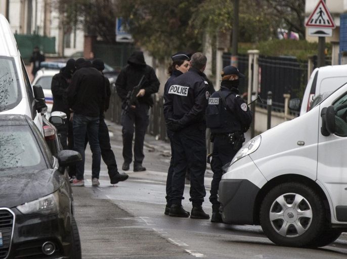 Police officers and investigators stand outside a building where an anti-terrorism operation took place in Argenteuil, near Paris, 25 March 2016. A terrorist attack had been thwarted in Paris with the arrest of a suspected terrorist whose plans for an attack were in an advanced state. A suspect terrorist named Reda Kriket has been arrested in Boulogne Billancourt.and Parisians lay and Belgian flags, flowers, candles, personalised messages for victims of terror attacks in Brussels in front of the monument on Place de la Republique, Paris, France, 23 March 2016. At least 31 people have been killed with hundreds injured in terror attacks in Brussels, Belgium on 22 March, which Islamic State (IS) has claimed responsibility for the attacks. EPA/IAN LANGSDON EPA/ETIENNE LAURENT