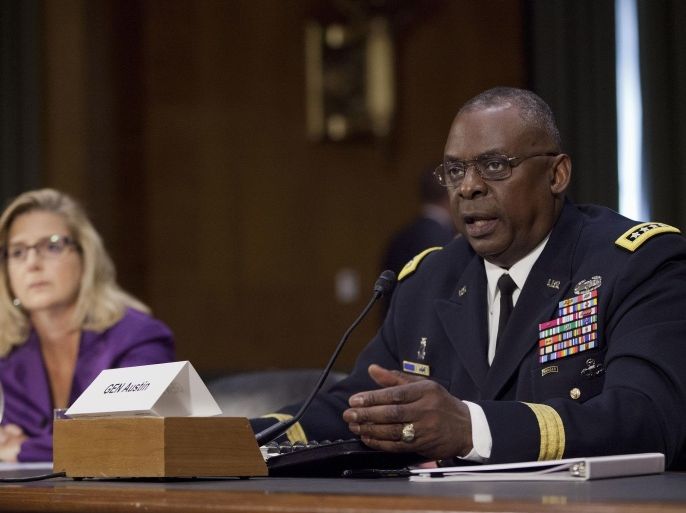 US Central Command Commander Gen. Lloyd Austin III, right, testifies on Capitol Hill in Washington, Wednesday, Sept. 16, 2015, before the Senate Armed Services Committee hearing on US military operations to counter the Islamic State in Iraq. Austin vowed to take "appropriate action" if an investigation indicates that senior defense officials altered intelligence reports on the Islamic State and other militant groups in Syria to exaggerate progress being made against the terrorist groups. Defense Undersecretary Christine E. Wormuth is at left. (AP Photo/Pablo Martinez Monsivais)
