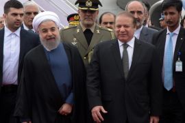 A handout picture released by Associated Press of Pakistan (APP) shows Iranian President Hassan Rouhani (L) walking with Pakistan's Prime Minister Nawaz Sharif (R) upon his arrival at at PAF Base Nur Khan, in Islamabad, Pakistan, 25 March 2016. Rouhani is on an official visit to Pakistan to discuss issues of mutual interest and regional security with Pakistani leadership. EPA/APP / HANDOUT