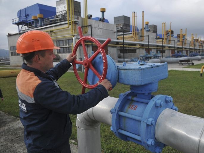 FILE - In this Wednesday, Oct. 7, 2015 file photo, a worker at a Ukrainian gas station Volovets in western Ukraine controls a valve. Russia’s state-controlled gas company is halting supplies to Ukraine, its chief executive said Wednesday, less than two months after the two countries struck an EU-sponsored deal. Gazprom’s CEO Alexei Miller said Russia sent the last shipment to Ukraine at 10 a.m. local time on Wednesday and send no more because Ukraine has not paid in advance for future supplies. (AP Photo/Pavlo Palamarchuk, File)