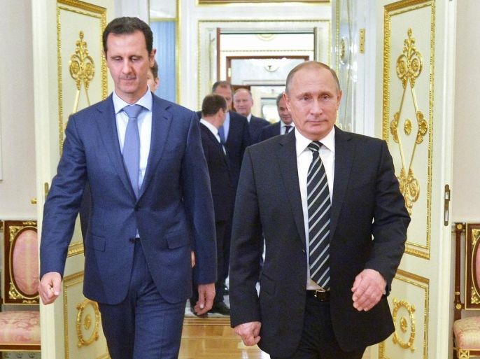 In this photo taken on Tuesday, Oct. 20, 2015, Russian President Vladimir Putin, right, and Syria President Bashar Assad arrive for their meeting in the Kremlin in Moscow, Russia. President Bashar Assad was in Moscow, in his first known trip abroad since the war broke out in Syria in 2011, to meet his strongest ally Russian leader Vladimir Putin. The two leaders stressed that the military operations in Syria_ in which Moscow is the latest and most powerful addition_ must lead to a political process. (Alexei Druzhinin, RIA-Novosti, Kremlin Pool Photo via AP)