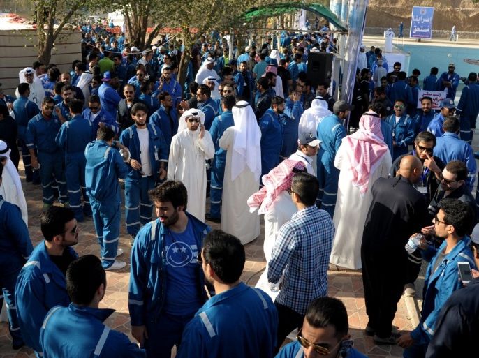 Kuwaiti oil and gas workers gather during a strike against salary cuts at Ahmadi Governorate, 33km south of Kuwait City, Kuwait, 17 April 2016. Oil workers unions in Kuwait started an open-ended strike to protest against proposed salary cuts that would affect all public employees. The strike coincides with a meeting of major oil-producing countries in Doha, Qatar, on 17 April to discuss plans to freeze oil production.