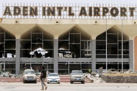 A Southern Resistance fighter walks past a damaged part of the international airport of Yemen's southern port city of Aden in this July 24, 2015 file photo. Aden airport is expected to reopen fully for commercial traffic within weeks, Yemen's information minister said, a move that would shore up confidence in the ability of President Abd-Rabbu Mansour Hadi's government to control the volatile city. REUTERS/Faisal Al Nasser/Files TPX IMAGES OF THE DAY