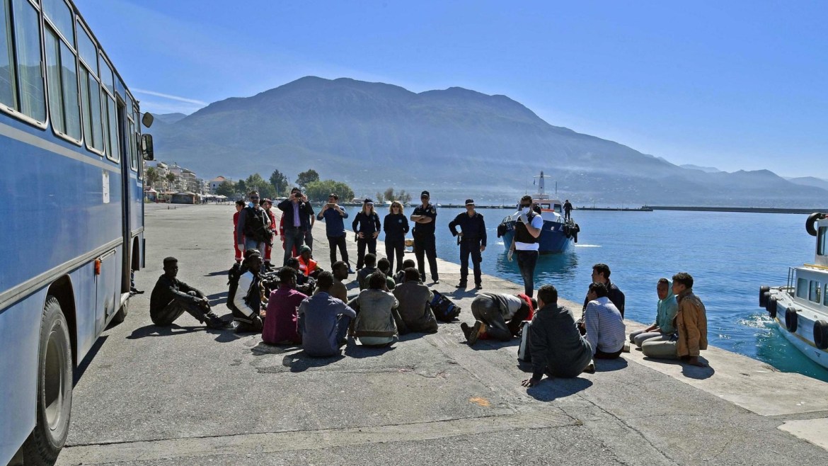 Coast guard members help migrants to disembark at the port of Kalmata in South Peloponnese, Greece, 17 April 2016. According to media reports, 41 refugees were collected from a wooden ship outside of Pylos.