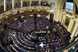 FILE -- In this Sunday, Jan. 10, 2016 file photo, members of Egypt's Parliament attend the inaugural session, the first to convene in three years, in Cairo, Egypt. A decision Monday, Jasn 11, 2016 to halt live coverage of its sessions has fueled media criticism and ridicule. Its inaugural session was supposed to be a mostly procedural session but it turned into a raucous affair, complete with shouting matches, chaos and disputes over the constitution. (AP Photo/Said Shahat, File)