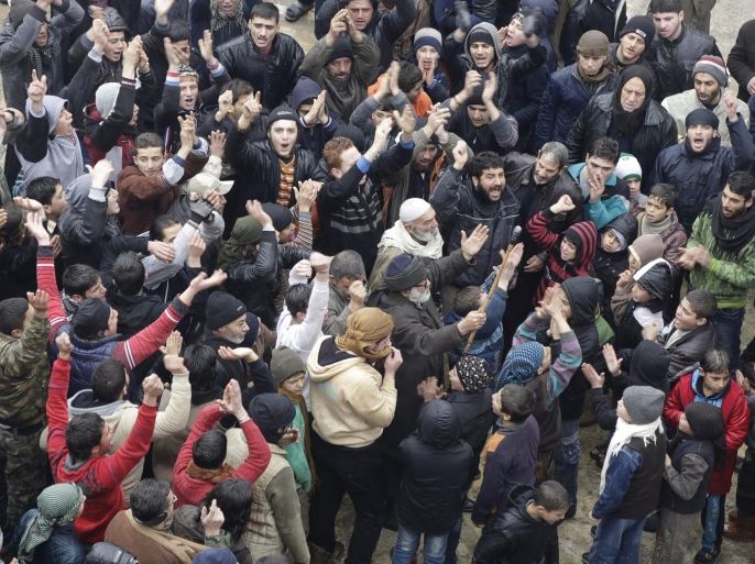People shout slogans during a protest after Friday prayers, calling for the lifting of the siege off Madaya, in the rebel-controlled area of Maaret al-Numan town in Idlib province, Syria January 8, 2016. The European Union on Friday welcomed Syrian President Bashar al-Assad's decision to allow humanitarian access to the town of Madaya, and called for a halt to all attacks on civilians in the conflict, ahead of peace talks later this month. REUTERS/Khalil Ashawi