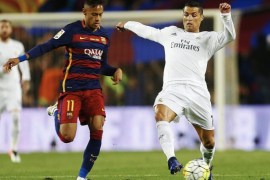 FC Barcelona's Brazilian striker Neymar Jr fights for the ball with Real Madrid's Portuguese striker Cristiano Ronaldo (R) during their Spanish Primera Division soccer match at Camp Nou stadium in Barcelona, northeasterm Spain, 02 April 2016.