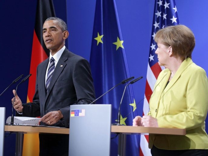 US President Barack Obama (L) and German Chancellor Angela Merkel (R) deliver remarks during a press conference at Herrenhausen Palace in Hanover, Germany, 24 April 2016. US President Obama is on a two-day visit to Germany.
