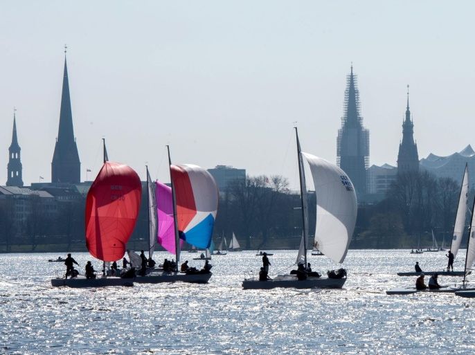 Sailboats sail in the beautiful weather on the Alster lake in Hamburg, Germany, 02 April 2016.