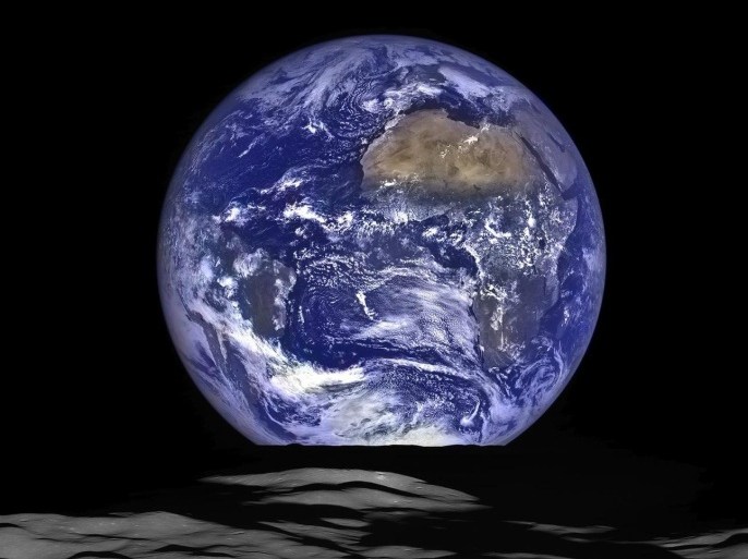 A handout picture made available by NASA on 19 December 2015 shows a composite image of a unique view of Earth captured by NASA's Lunar Reconnaissance Orbiter (LRO) from the spacecraft's vantage point in orbit around the moon, 12 October 2015. In the image, Earth appears to rise over the lunar horizon from the viewpoint of the spacecraft, with its center just off the coast of Liberia (at 4.04 degrees North, 12.44 degrees West). The large tan area in the upper right is the Sahara Desert, and just beyond is Saudi Arabia. The Atlantic and Pacific coasts of South America are visible to the left. This image was composed from a series of images taken on 12 October, when LRO was about 134km above the moon's farside crater Compton. EPA/NASA/GODDARD/ARIZONA STATE UNIVERSITY