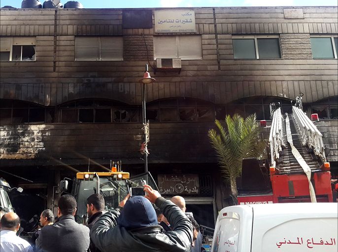 فلسطين رام الله 14 نيسان 2016 هجوم اسرائيلي على محلات للصرافة وسط رام الله أدى إلى احتراق بناية من ثلاثة طوابق وعدد كبير من المتاجر