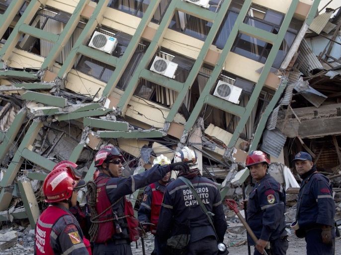 Rescue workers from Venezuela organize themselves before they search for earthquake survivors in Portoviejo, Ecuador, Monday, April 18, 2016. The strongest earthquake to hit Ecuador in decades flattened buildings and buckled highways along its Pacific coast, sending the Andean nation into a state of emergency. (AP Photo/Rodrigo Abd)