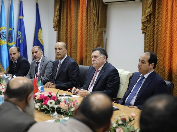 Libya's unity government's Prime Minister-designate Fayez al-Sarraj (4-L) chairs a meeting of the presidential council with Tripoli municipal council in Tripoli, Libya, 31 March 2016. Reports state Sarraj and the UN-backed presidential council arrived in Tripoli on 30 March.