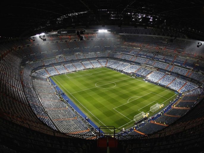 A general view is seen of the Santiago Bernabeu stadium prior to the "Clasico" soccer match between Real Madrid and Barcelona in Madrid, in this December 10, 2011 file picture. Madrid, who won the Spanish league last May for the 32nd time, rivals Barcelona proved that passion for Spanish soccer remains undimmed despite the country's financial crisis, cementing their place as the highest revenue earners in the world's most popular sport, business services group Deloitte said on Thursday. Madrid became the first club in any sport to generate more than 500 million euros ($664 million)in annual revenues, Deloitte said in its annual Football Money League for 2011-12. Picture taken December 10, 2011. REUTERS/Sergio Perez/Files (SPAIN - Tags: SPORT SOCCER BUSINESS)