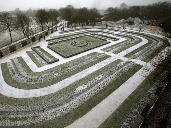 People visit the newly opened graveyard for Schalke 04 fans in Gelsenkirchen, Germany, 07 December 2012. In reference to the founding year, the stadium-shaped yard consists of 1904 graves. 