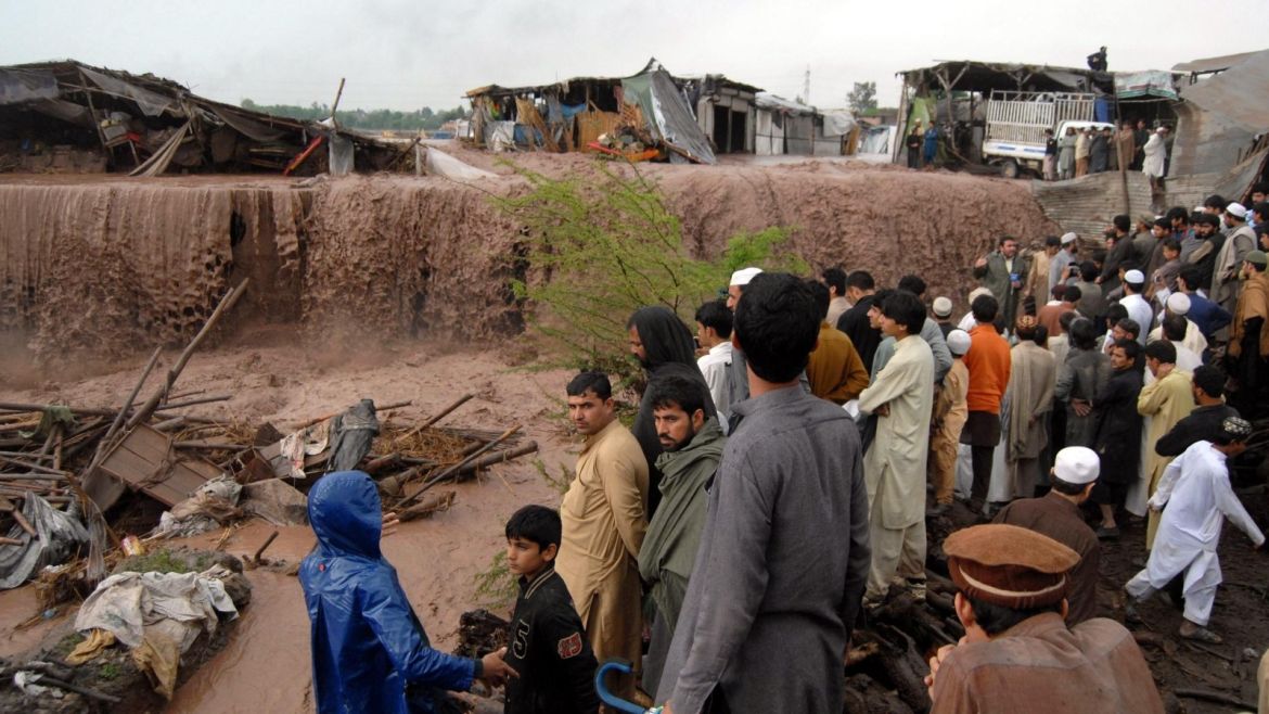 People gather around their shops after they were swept away by flash floods triggered by heavy rain falls on the outskirts of Peshawar, the provincial capital of Khyber-Pakhtunkhwa province, Pakistan, 03 April 2016. At least 42 people were killed in floods triggered by torrential rains in Pakistan's Khyber-Pakhtunkhwa province and Gilgit-Baltistan.