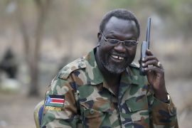 Riek Machar, South Sudan's then rebel leader, talks on the phone in his field office in a rebel-controlled territory in Jonglei State, South Sudan, in this February 1, 2014 file photo. REUTERS/Goran Tomasevic/Files TPX IMAGES OF THE DAY