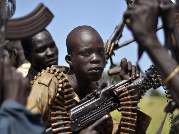 FILE-- In this file photo of Friday, Sept. 25, 2015. South Sudan government soldiers in the town of Koch, Unity state, South Sudan. A U.N. report describing sweeping crimes like children and the disabled being burned alive and fighters being allowed to rape women as payment shows South Sudan is facing "one of the most horrendous human rights situations in the world," the U.N. human rights chief said Friday, March 11, 2016. ((AP Photo/Jason Patinkin, File)