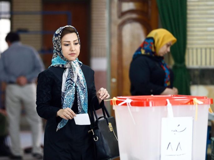An Iranian woman holds her ballot paper at a polling station during the second round of parliamentary elections at the Jameh Mosque in the city of Shahre Ghods, Iran, 29 April 2016. Polling stations opened in Iran on 29 April for the second round of parliamentary elections, in which 136 candidates are competing for 68 seats still vacant after the 26 February polls.