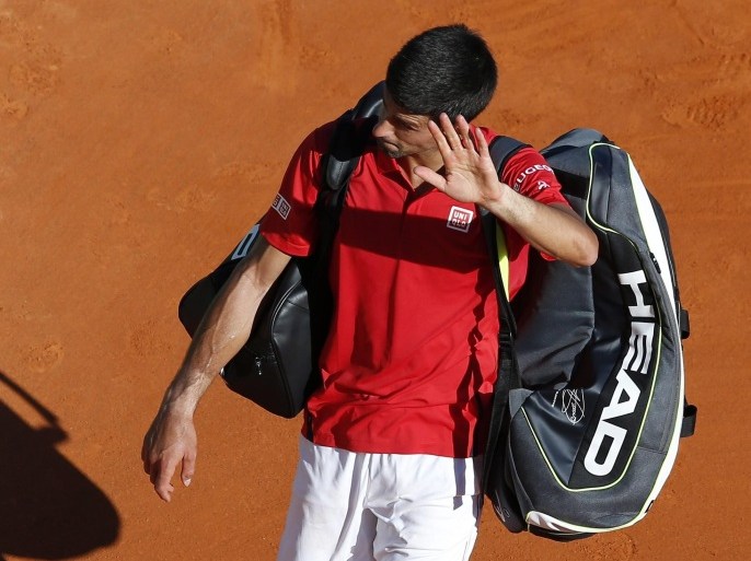 Novak Djokovic of Serbia leaves the court after losing his second round match to Jiri Vesely of Czech Republic at the Monte-Carlo Rolex Masters tennis tournament in Roquebrune Cap Martin, France, 13 April 2016.