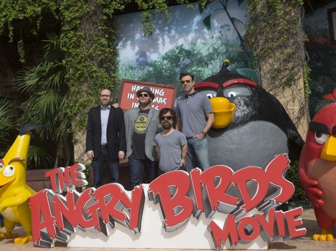 Producer John Cohen, left, actors Josh Gad, second left, Peter Dinklage, second right, and Jason Sudekis pose for photographers to promote their upcoming film "The Angry Birds movie" at the Summer of Sony photo call in Cancun, Tuesday, June 16, 2015. (AP Photo/Christian Palma)