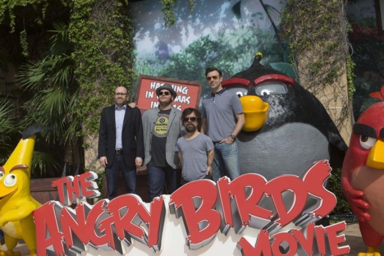 Producer John Cohen, left, actors Josh Gad, second left, Peter Dinklage, second right, and Jason Sudekis pose for photographers to promote their upcoming film "The Angry Birds movie" at the Summer of Sony photo call in Cancun, Tuesday, June 16, 2015. (AP Photo/Christian Palma)