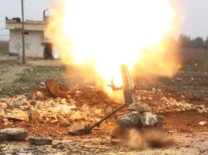 Free Syrian Army fighter fires a shell towards Islamic State fighters in the northern Aleppo countryside, Syria, January 18, 2016. The Sultan Murad brigade, part of the Free Syrian Army, with the help of air strikes carried out by the U.S.-led coalition, took control of the Hur-klas, Ghazal and Yan-yaban villages on the border with Turkey, from Islamic State fighters, in the northern Aleppo countryside, activists said. REUTERS/Abdelrahmin Ismail