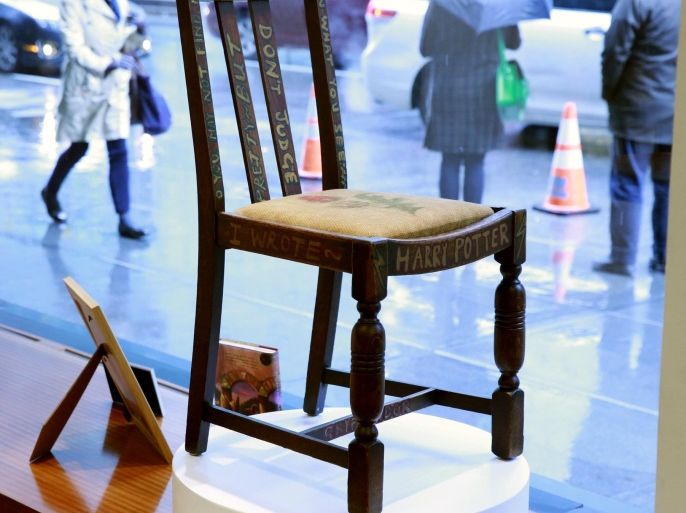 A chair used by British author J.K. Rowling while writing "Harry Potter and the Sorcerer's Stone" and "Harry Potter and the Chamber of Secrets" is shown in the window of Heritage Auctions in New York April 4, 2016. REUTERS/Lucas Jackson