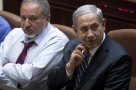 Israeli Prime Minister Benjamin Netanyahu (R), Israeli Foreign Minister Avigdor Lieberman (C) and Israeli Defense Minister Moshe Ya'alon (L) attend the 2015 budget voting at the Israeli Knesset plenum in Jerusalem, Israel, 10 November 2014. Media reports on the possibility of early primaries due to controversies between the parties of the Israeli Parliament.