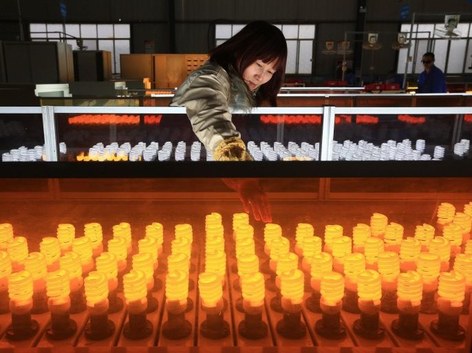 (FILE) A file photo dated 04 January 2016 showing a woman working on the production line of energy-saving lamps in a factory in Suining in southwest China's Sichuan province, China. China's industrial sector showed signs of expansion in March, after seven months of contraction, according to the Purchasing Managers' Index, PMI, published every month by the National Bureau of Statistics of China. The PMI rose to 50.2 points in March, up from February's 49 points. The indicator above 50 points marks the expansion of the manufacturing sector while the indicator below 50 reveals reduction in industrial activity. The National Bureau of Statistics also published 01 April 2016 the PMI of the service sector, which stood at 53.8 points after two months of a downward trend (53.5 points in January and 52.7 February). EPA/ZHONG MIN CHINA OUT