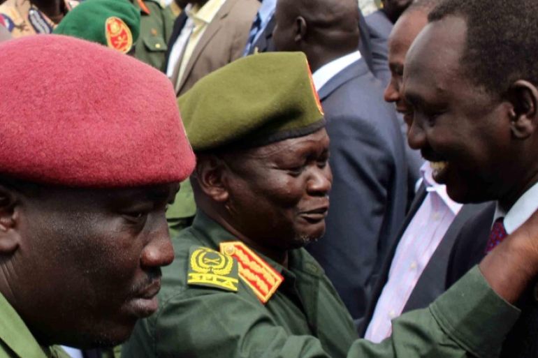 General Simon Gatwech Dual (C), the chief of staff of the South Sudan rebel troops, is received by unidentified officials upon arrival in Juba, South Sudan, 25 April 2016. Reports state General Simon Gatwech Dual, the chief of staff of the Sudan People's Liberation Movement-in-Opposition (SPLM-IO), the rebel group led by former vice-president of South Sudan Riek Machar, arrived in Juba along with 195 soldiers ahead of a planned return of Machar as part of a peace agreement.